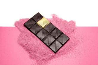 Quirky photo art featuring golden chocolate and a cheerful character