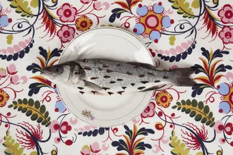 Wall art featuring a fish pattern combined with blooming flowers.