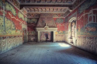 A decayed country house in Italy, featuring a fireplace and worn walls.