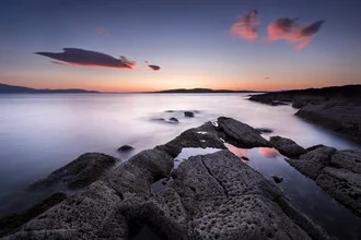 Photo art by Felix Baab: sunset over rugged rocks in Scotland.