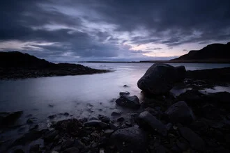 Photo art by Fabian Wanisch: calm sunrise over a bay with rocks and sea