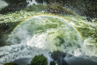 Photo art by Andreas Adams: Rainbow over the Iguazu Falls in Brazil.