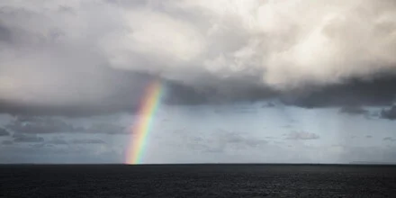 Clouds and a rainbow over the ocean in Australia, peaceful mood