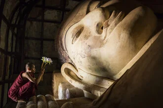 Wall art by Andreas Adams: a meditating monk in front of a lotus flower in Myanmar.