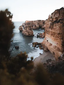 Photo art by Maximilian Pohler: serene coastline scene with rocks and waves