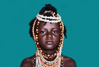 Photo art by Victoria Knobloch: Black girl wearing beads in a fashionable outfit