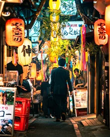 Photo art of a busy man in a lit alley in Tokyo.
