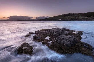 Photo art by Felix Baab: gentle sunset over rocks and waves