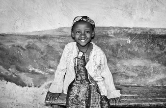 Smiling girl in Jinka radiating joy and innocence.