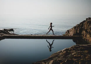 Photo art by Julian Wedel: Woman walking gracefully by the pool.