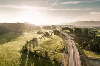 Photo art by Johannes Bauer: morning mood over a Bavarian meadow and highway