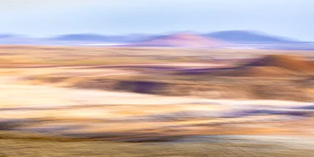 Photo art featuring blurred hills and volcanoes in vibrant colors