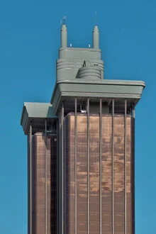 Photo art by Michael Belhadi: Torre Colon facade in Madrid under sunlight.