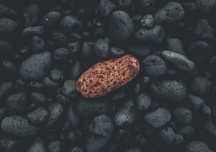 Photo art by Pascal Genzel: red stones on the lonely black beach of Lanzarote.