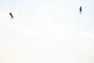 Wall art by Tal Paz-fridman: joyful children playing on the beach under the sun