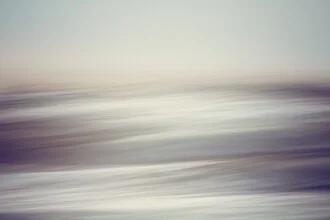 Photo art: gentle wave movements at the beach in calming shades of blue