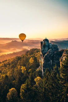 Photo art by Tobias Winkelmann: hot air balloon over moody landscape at sunrise