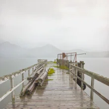 Abandoned pier in Norway, gentle colors and calm mood in the fjord.