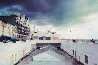 Photo art by Eva Stadler: pastel rooftops beneath a cloudy sky in Hastings