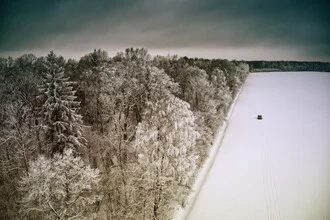 Photo art by Giedra Bartas: snowy road beneath a dark sky