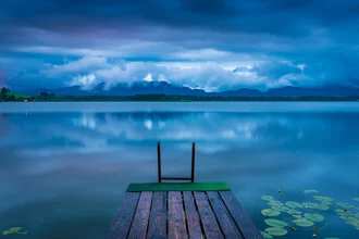 Photo art by Martin Wasilewski: calm lake at blue hour in the Allgäu region.