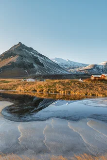 Winterscape in Iceland: snowy landscape with ice and a serene lake