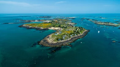 Aerial view of Chausey Island in Normandy with gentle waves and clear skies