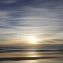 Photo art by Steffi Louis: calm scene with gentle waves and sunlight on the horizon