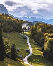 Photo art by Thomas Müller: autumnal alpine road with a church in the background
