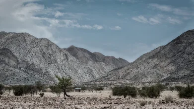 Vast landscape in Namibia featuring mountains and gentle hills.