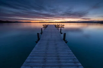 Morning light at a jetty with calm water and soft colors.