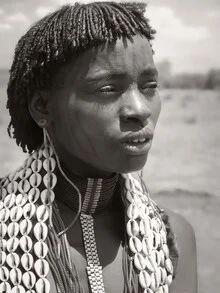 Portrait of a woman with a face tattoo reflecting her cultural identity.