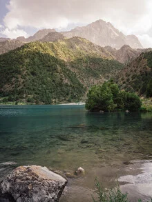 Photo art by Claas Liegmann: mountain lake surrounded by majestic mountains at sunset