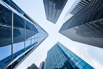 Photo art by Jan Becke: modern office buildings in Frankfurt under a blue sky