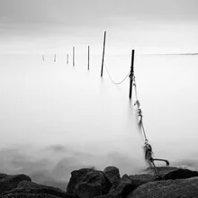 Photo by Stephan Opitz: serene arrangement of fishing nets by the sea