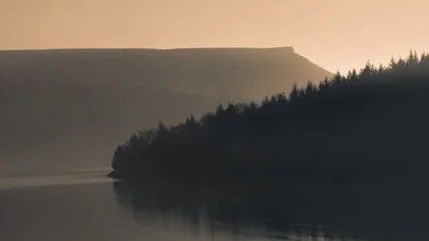 Photo art by Ashley Groom: calm sunrise over a lake in the Peak District.