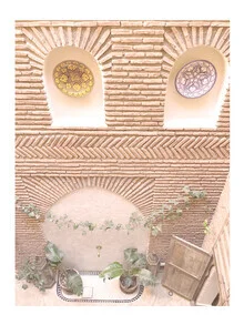 Photo art by Christina Wolff: courtyard of a Moroccan riad featuring mosaics and plants