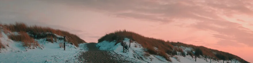 Snow-covered dune rising gently, serene coastal landscape in soft colors