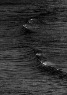 Photo art featuring gentle waves reflecting ocean light.