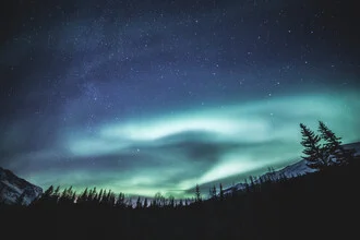 Photo art by Sebastian Worm: starry sky over Norway with Northern Lights