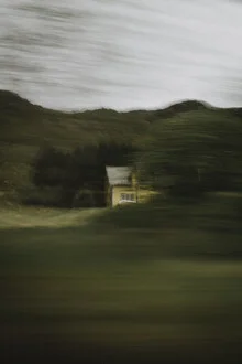 Long exposure of a blurry yellow house in Norway