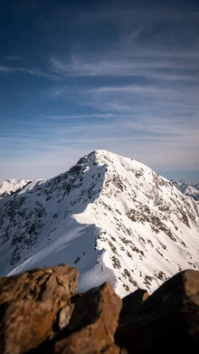 Photo art by Clemens Bartl: serene winter landscape in Graubünden with snow-covered mountains