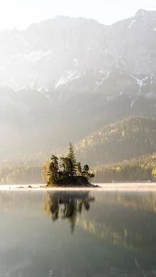 Photo art by Clemens Bartl: tranquil island with mountain reflections on the water