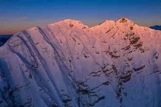 Photo art by Clemens Bartl: first sunlight over snow-covered peaks