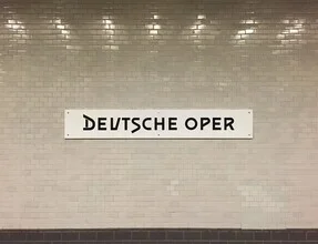 Charming Deutsche Oper subway station in Berlin, featuring clean lines and a calm atmosphere.