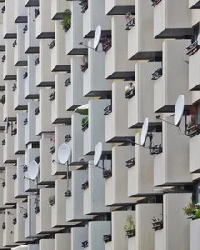Photo art by Roc Isern: modern building with satellite dishes in an urban setting