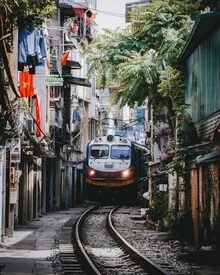 Photo art by André Alexander: train ride through a vibrant Vietnamese landscape.