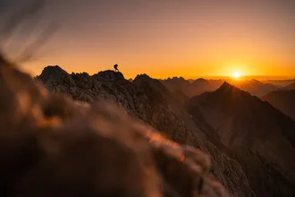 Photo art by Clemens Bartl: sunrise over the Tyrolean mountains.