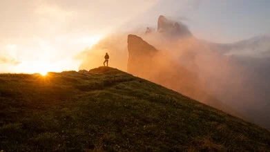 Burning Seceda at sunrise over the Dolomites, soft colors and a serene mood.