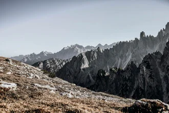Photo art by Jasmin Hertrich: serene Dolomite landscape with mountains and clouds.